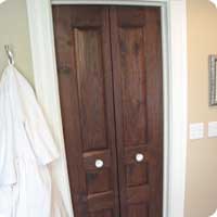 Bi-fold custom raised panel walnut door