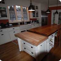 Reclaimed barn oak island table and hardwood maple butchers block