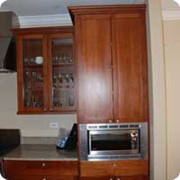 Cherry kitchen cabinet and custom trim
